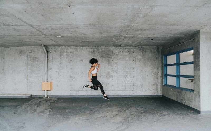 exercising woman caught jumping in mid-air