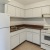 a kitchen with white cabinets