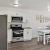 a kitchen with white cabinets